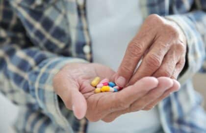 Senior taking his prescription medication